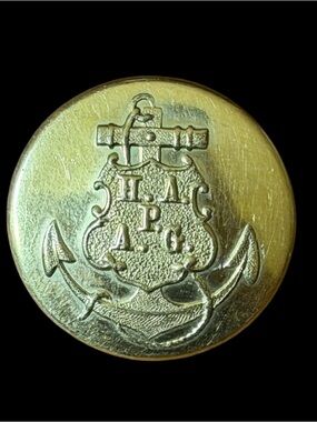 A Vintage brass uniform button from the Hamburg America Line (HAPAG). 1”